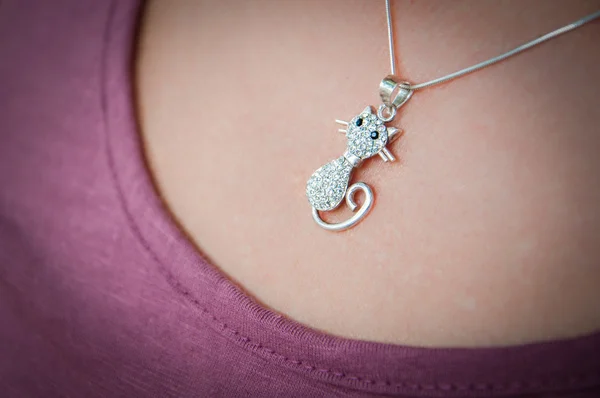 Silver chain with a pendant on a girl neck