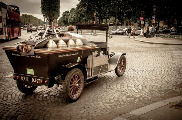 Old timer car as a touristic attraction of Champs Elysees in Paris, France