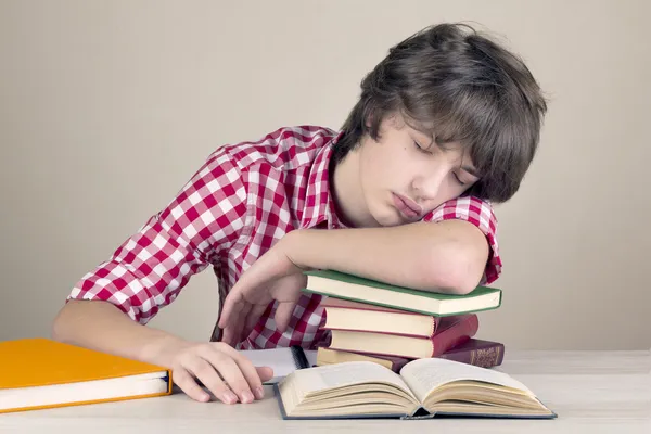 Tinager student falls asleep doing homework
