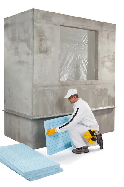 Worker setting up an insulation panel