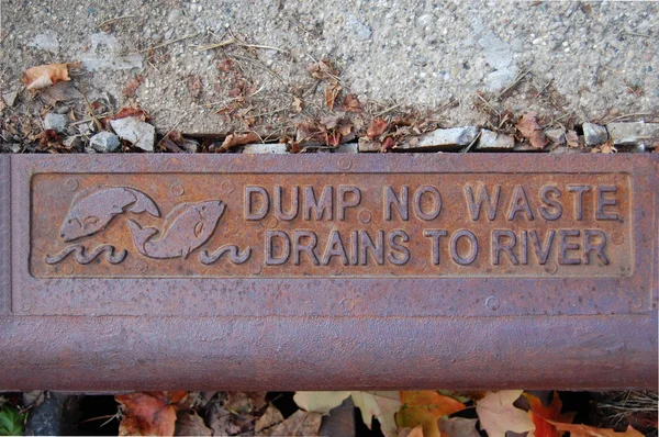 Dump no waste drains to river - with two fish