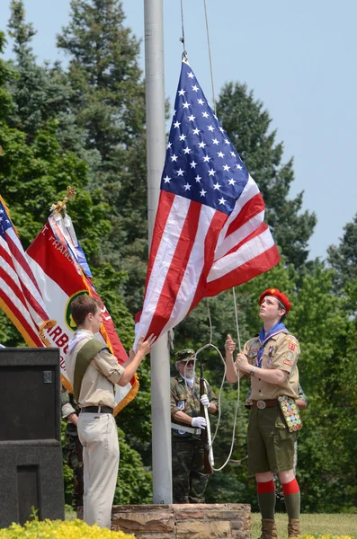 Boy scouts raising flag