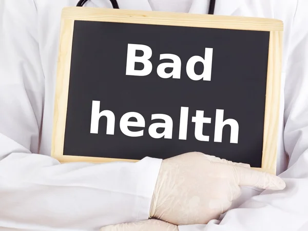 Doctor shows information on blackboard: bad health