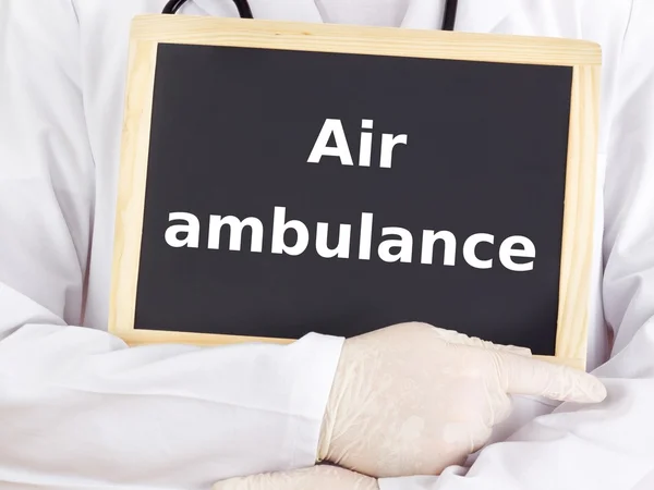 Doctor shows information on blackboard: air ambulance