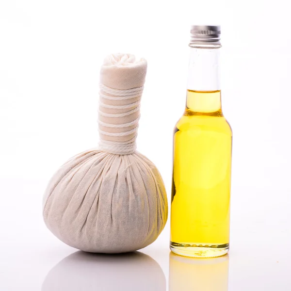 Herbal compress ball and massage oil for spa treatment