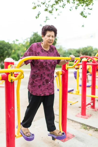 Asian senior woman exercising in the part outdoor