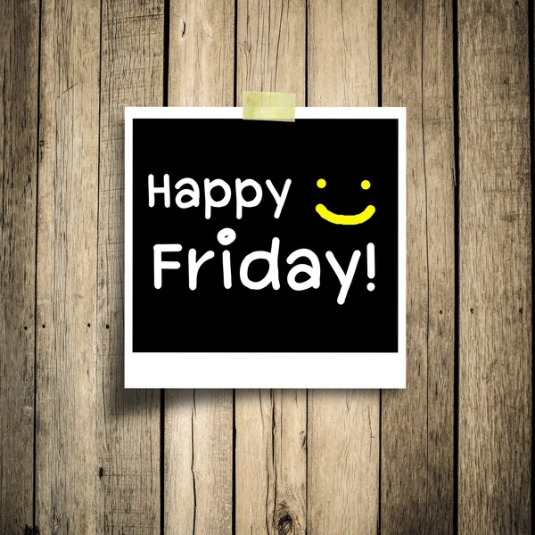 Happy Friday on grunge wooden background with copy space