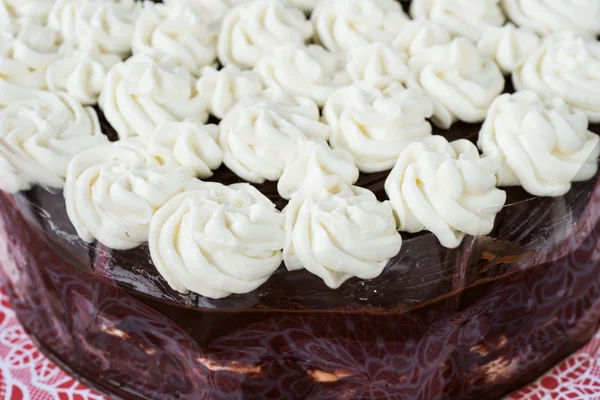 Chocolate cake butter with plastic wrap on processing