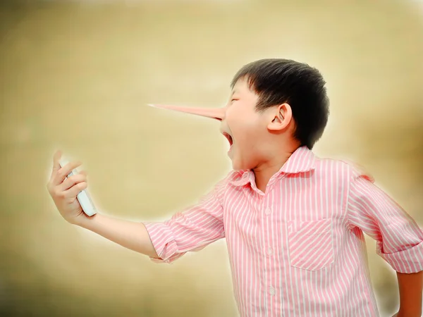 Long nose Angry Asian child shouting At Mobile Phone,liar concep