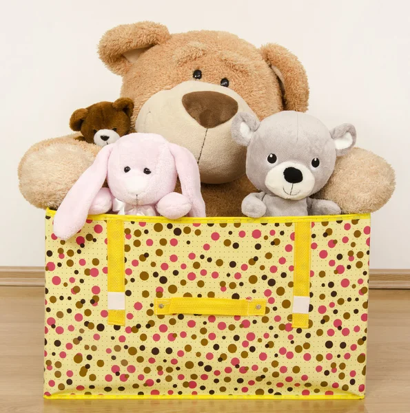 A box full of toys, three bears and a funny rabbit