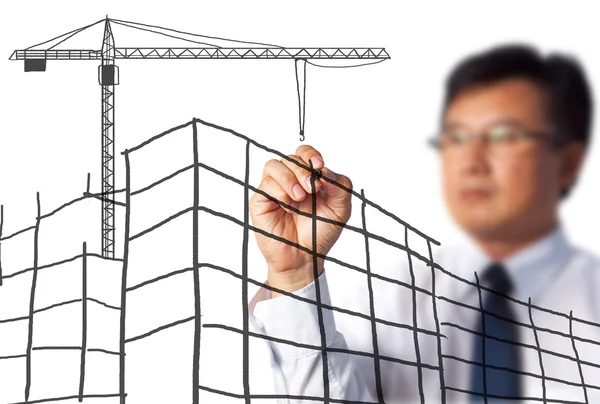 Business man drawing construction site