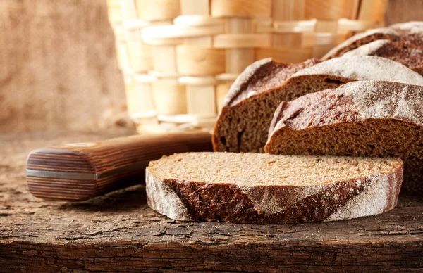 Sliced brown bread with knife
