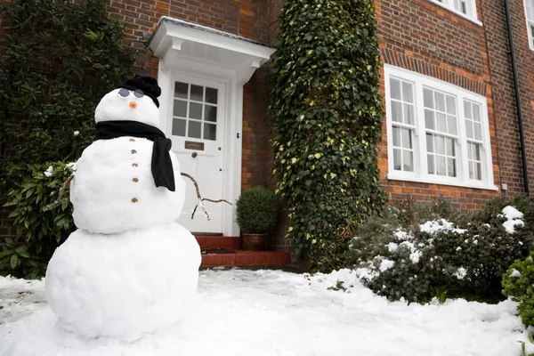 Snowman and house