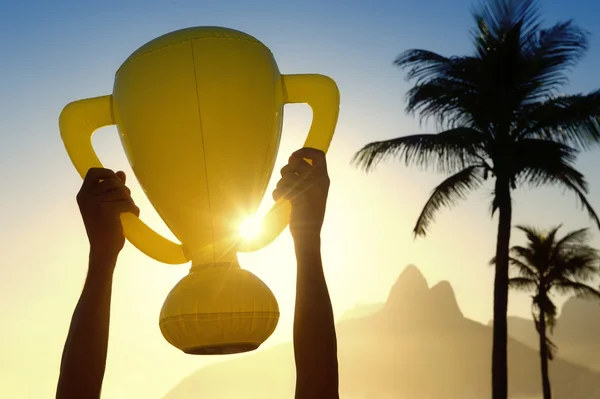 Hands Holding Trophy Rio de Janeiro Skyline