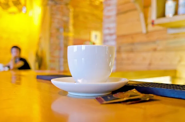 Coffee mug on a wooden bar counter