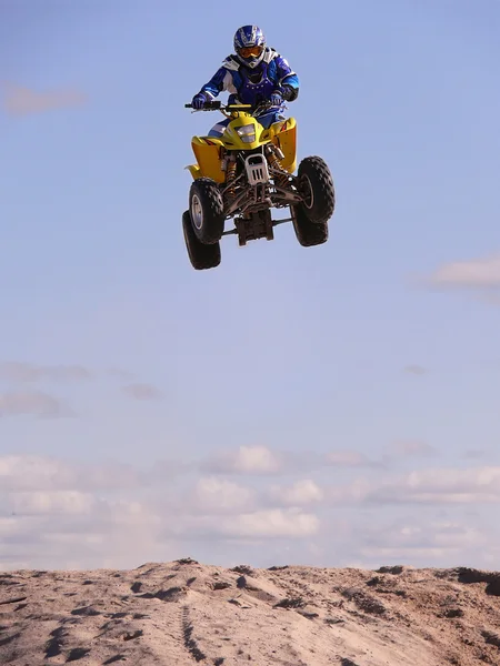 Vadim Vasuhin in high jump with springboard on quadrocycle during extreme motorcross racing August 26, 2007 in Nadym, Russia.
