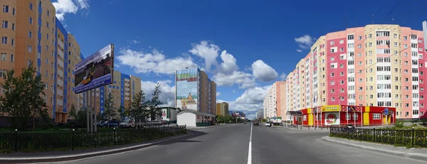 Nadym, Russia - July 10, 2008: the Panorama. Urban landscape, houses, shops in Nadym, Russia - July 10, 2008. City Central road riding on his car.