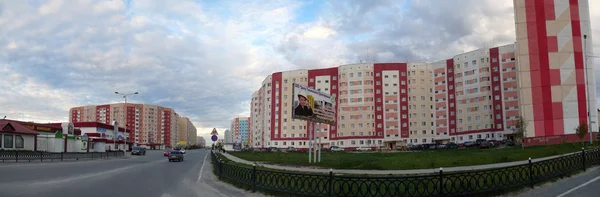 Nadym, Russia - July 10, 2008: the Panorama. Urban landscape, houses, shops in Nadym, Russia - July 10, 2008. City Central road riding on his car.