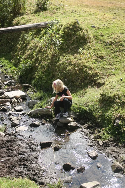 Young Girl by a Stream