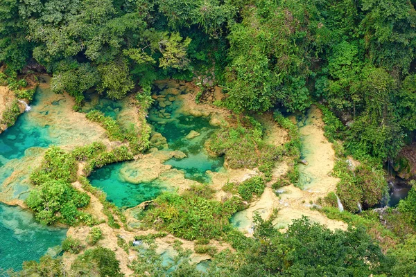 View from the top to the cascades in the jungles of Guatemala