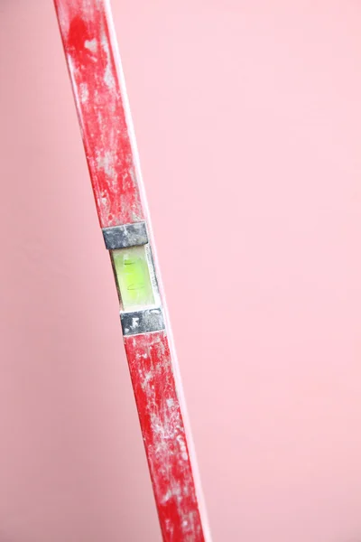 Level Construction worker home pink background
