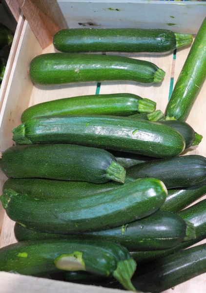 Green zucchini courgette in the supermarket