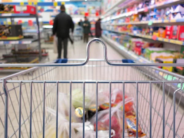 View of a shopping cart with grocery items