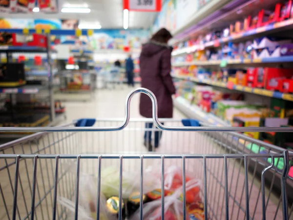 View of a shopping cart with grocery items