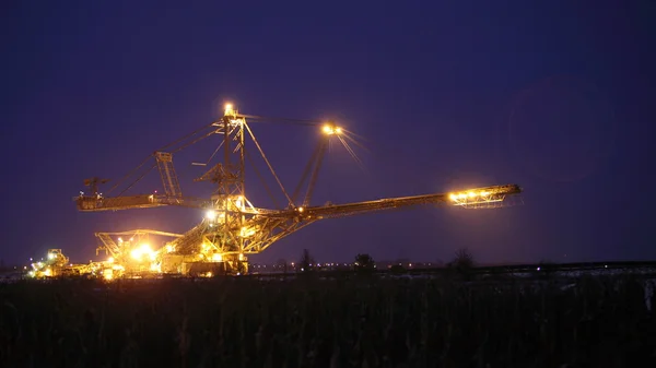 Giant excavator in a coal open pit evening