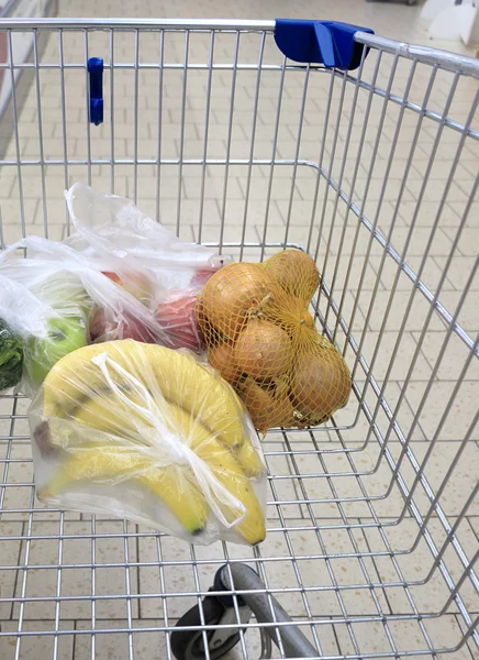 Shopping cart with grocery at supermarket