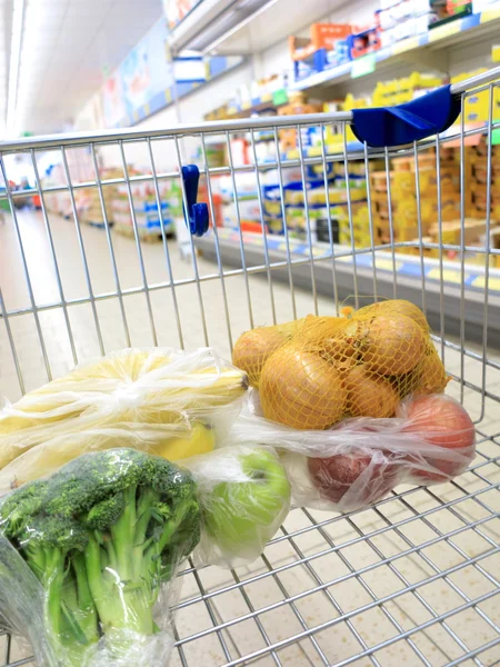 Stock Photo: Shopping cart with grocery at supermarket