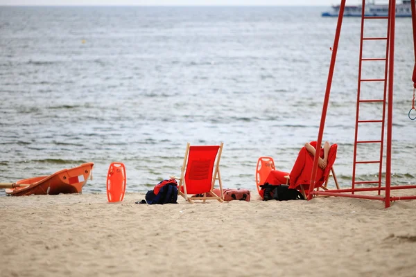 Lifeguard beach rescue equipment orange boat