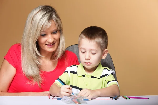 Mother and son drawing together