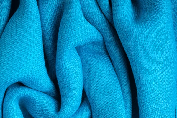 Blue background abstract cloth wavy folds of textile texture