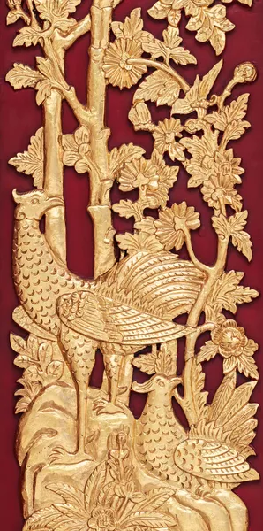Mythical Thai Style Carving on red Wooden Wall, General Thai Temple Art