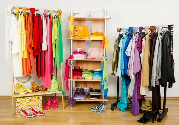 Wardrobe with summer clothes nicely arranged.