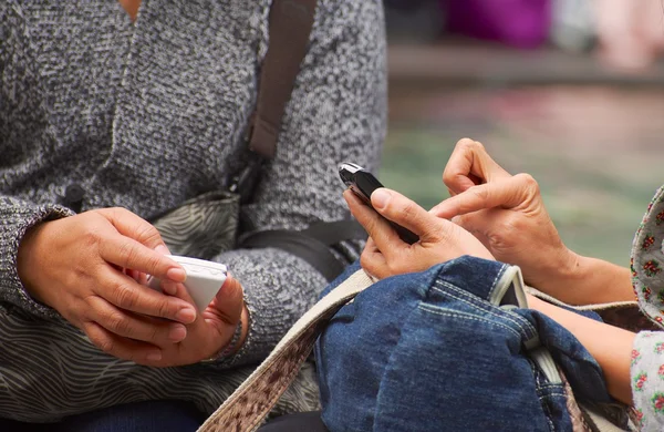 Hands with mobile phones