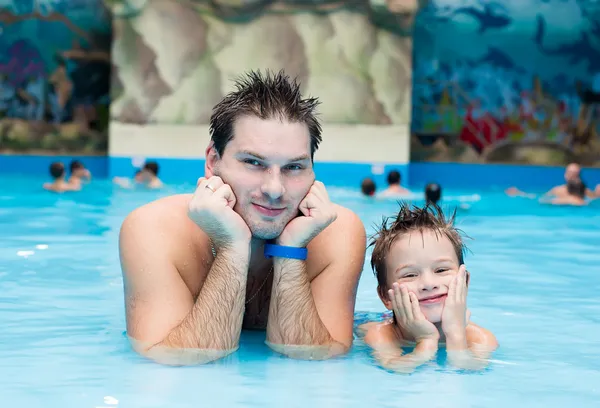 Father and son in the pool