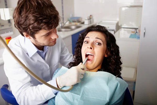 Scared patient at dentist office have teeth checkup