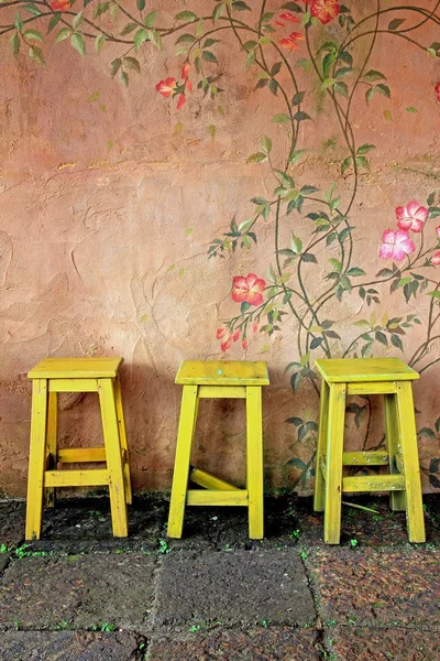 Old vintage wooden chair and wall