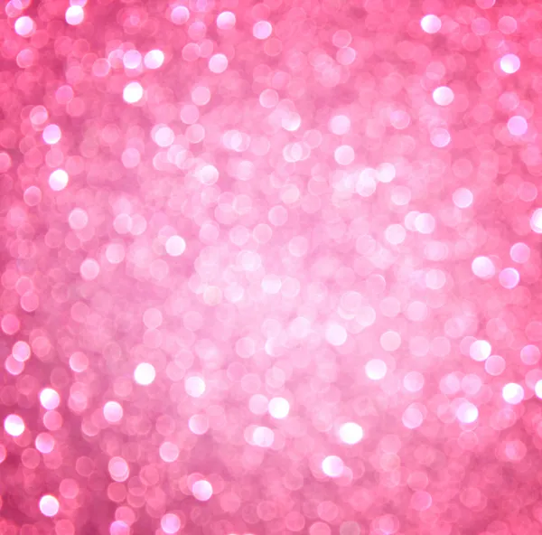 Pink abstract glitter bokeh lights. defocused lights background.
