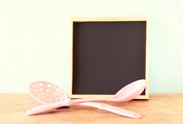 Blackboard and serving spoons