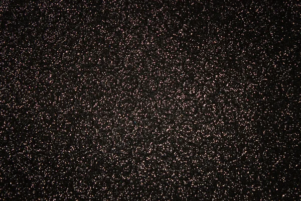 Glitter black lights background.