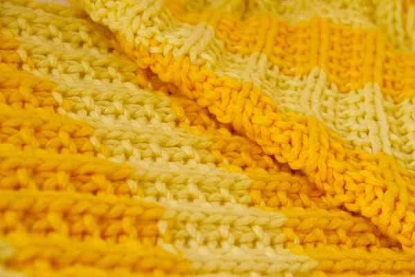 Knitted cloth of brightly yellow and orange color — Stock Photo #15274315
