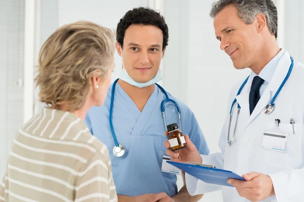 Doctor Prescribing Medication To Patient