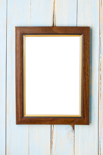 Wooden picture frame on a wooden blue background