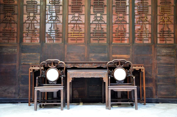 Two chairs in the old Chinese house