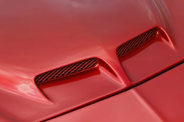 Red sports car hood