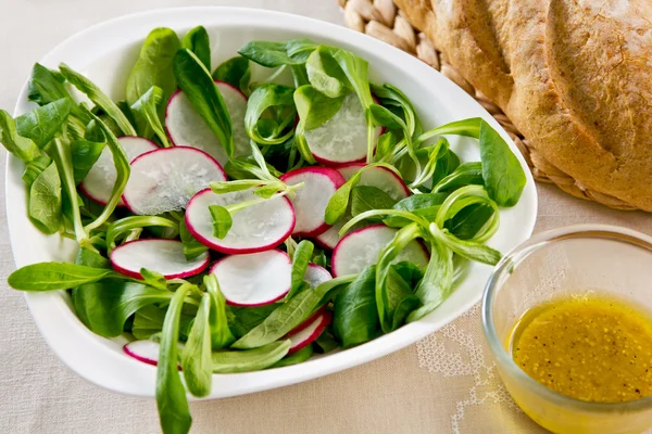 Radish, corn salad salad with mustard dressing