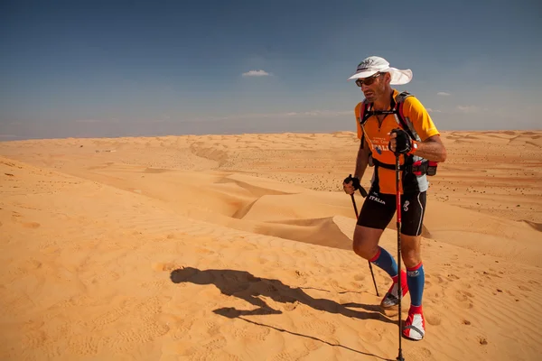 Man running extreme desert marathon in Oman